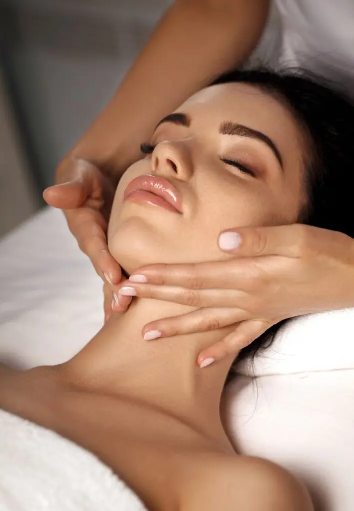 Woman with bright hydrated skin receiving treatment at a med spa
